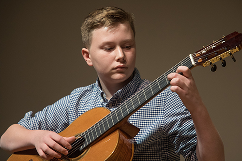 student playing guitar