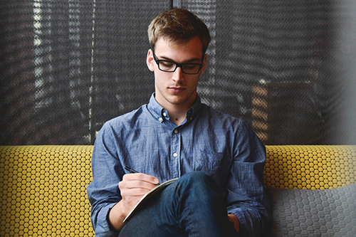 man working on couch