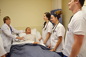 nursing students and teacher practicing