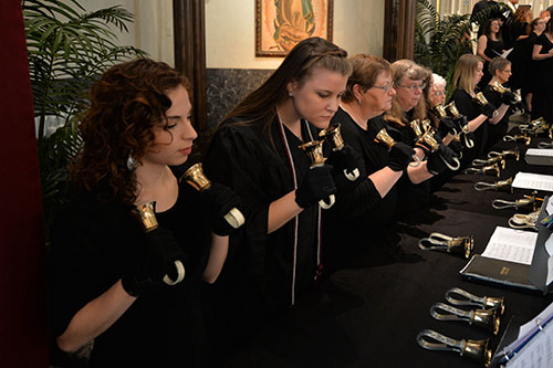 students playing handbells