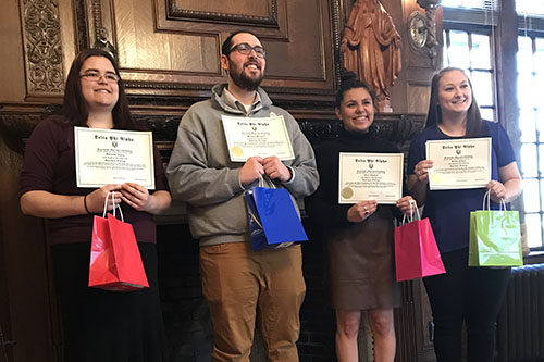 students holding certificates