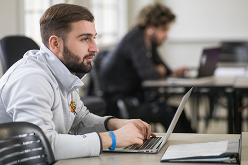 student at laptop