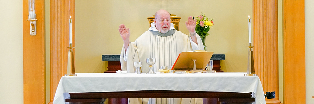 Father Stan at the front of chapel