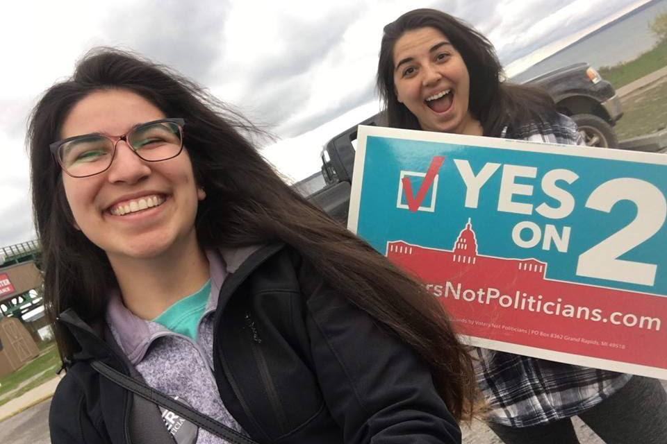 Students with signs That read "Yes on 2"