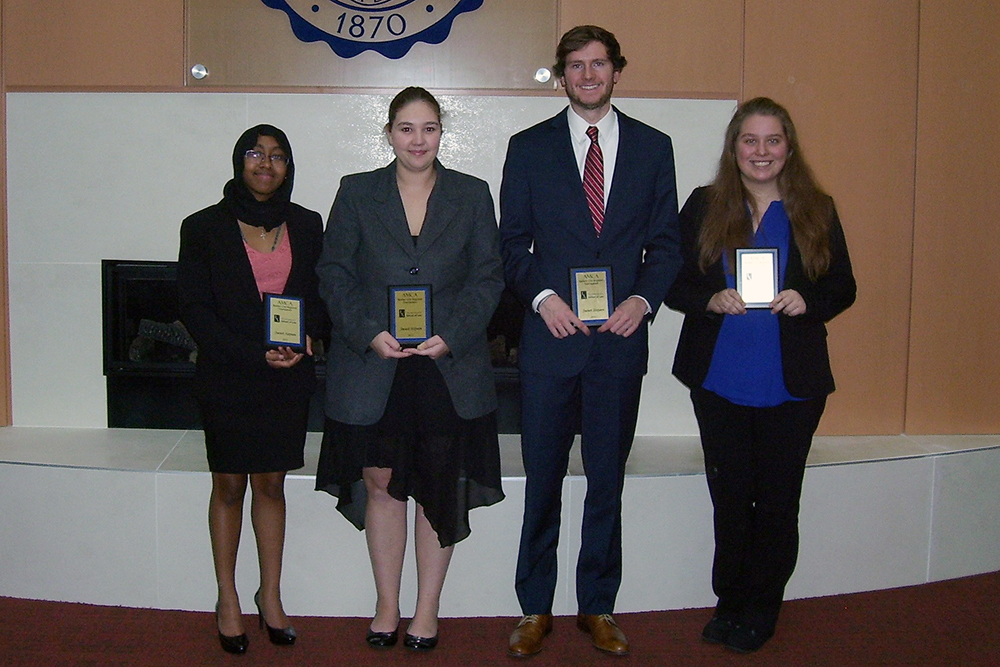 Students holding awards