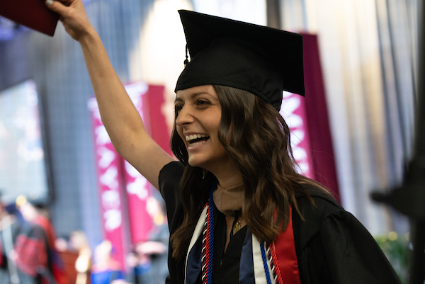 Student with french flag stole cheering at graduation