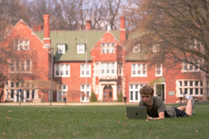 CIS srtudent on Holmdene lawn