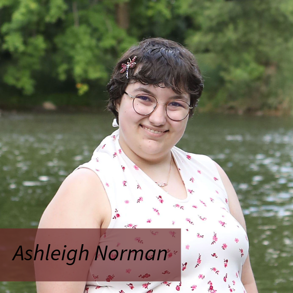 Headshot of a girl with short, dark hair in front of a river. Text reading: Ashleigh Norman
