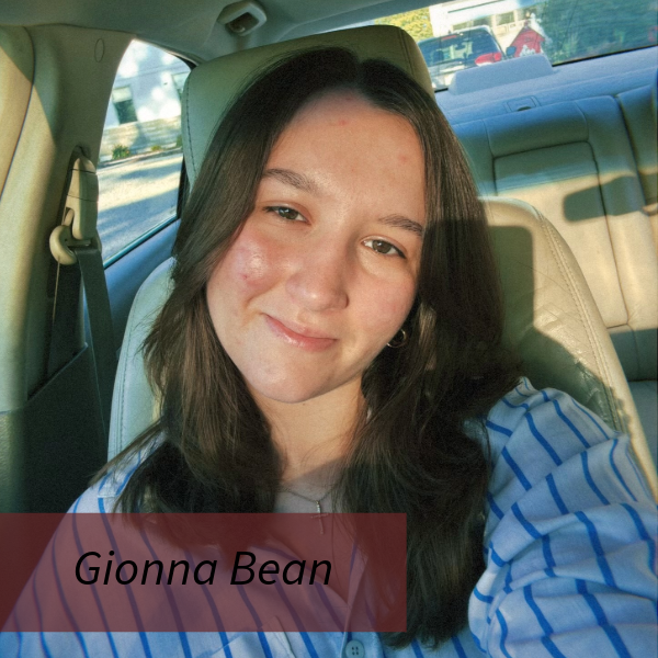 Selfie of a girl with long, dark hair, in a car. Text reading: Gionna Bean