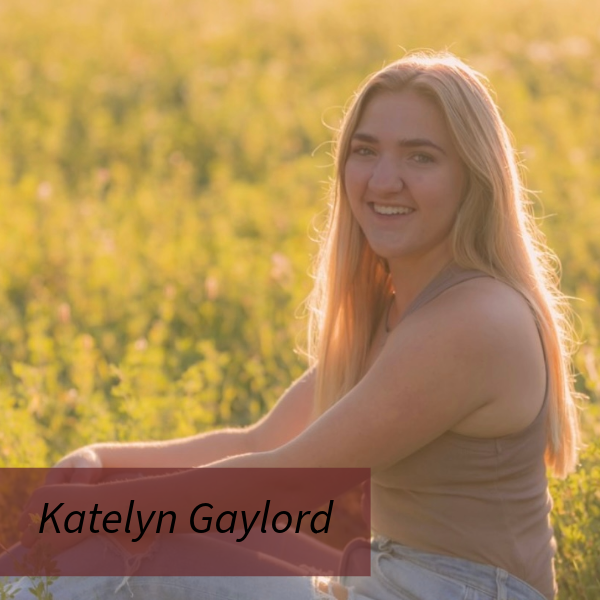 Picture of a girl with long, blonde hair, in a field. Text reading: Katelyn Gaylord.