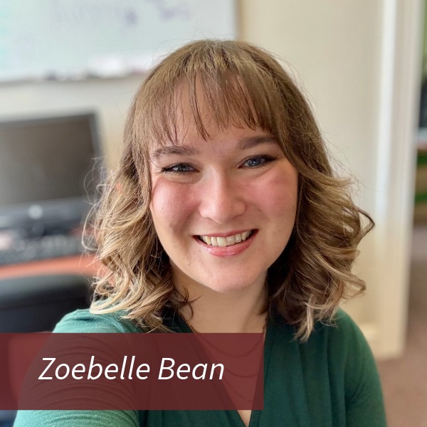 Selfie of a girl with long hair, holding a package outside, in front of a sign for St. Catherine of Sienna Hall. Text reading: Zoebelle Bean, Writing Center Consultant.