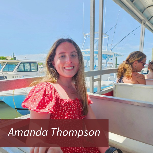 Headshot of a girl with long brown hair, in an Aquinas College cheerleading uniform, in front of a maroon background. Text reading: Amanda Thompson, Writing Center Consultant.