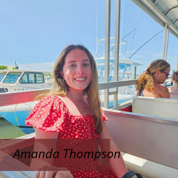Headshot of a girl with long brown hair, in an Aquinas College cheerleading uniform, in front of a maroon background. Text reading: Amanda Thompson, Writing Center Consultant.