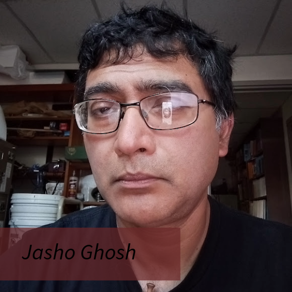 Headshot of a man with short, dark hair and glasses in front of a gray background. Text reading: Jasho Ghosh, Writing Center Consultant, Faculty Liaison.