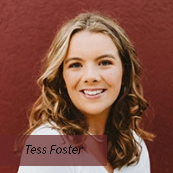 Headshot of a girl with shoulder length hair, in front of a red wall. Text reading: Tess Foster, Writing Center Consultant, Magna Verba Proofreader.
