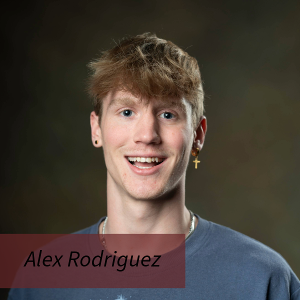 Headshot of a boy with blonde hair and a cross earring, in front of a brown background. Text reading: Alex Rodriguez, Writing Center Consultant.