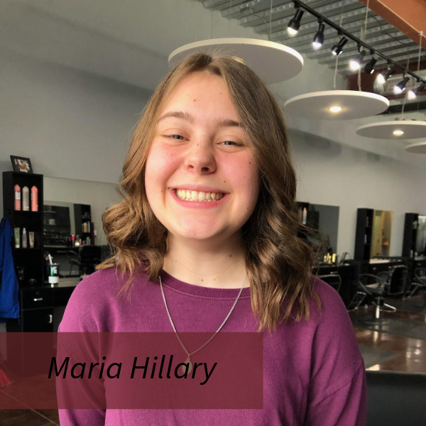 Picture of a girl with shoulder length hair, wearing a purple shirt, in a hair salon. Text reading: Maria Hillary, Writing Center Consultant.