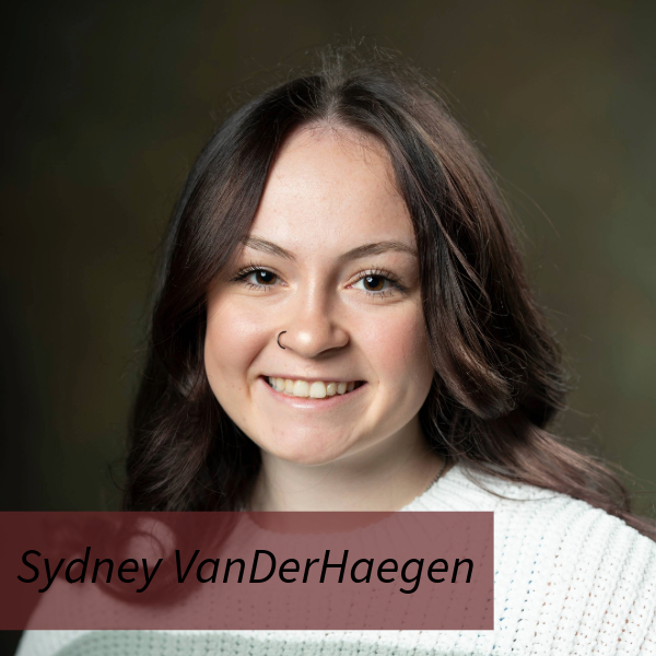 Headshot of a girl with long, dark hair and a nose ring in front of a brown backdrop. Text reading: Sydney VanDerHaegen, Writing Center Consultant.