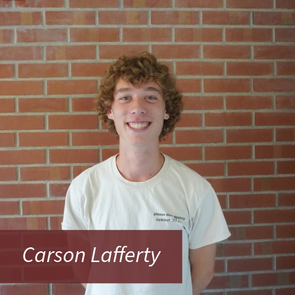 Headshot of a boy with curly blonde hair in front of a brick wall. Text reading: Carson Lafferty, Writing Center Consultant, Task Force: New Consultant Liason.
