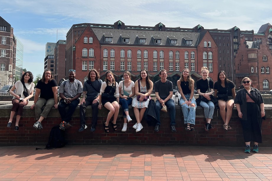 Students posed on a wall in germany