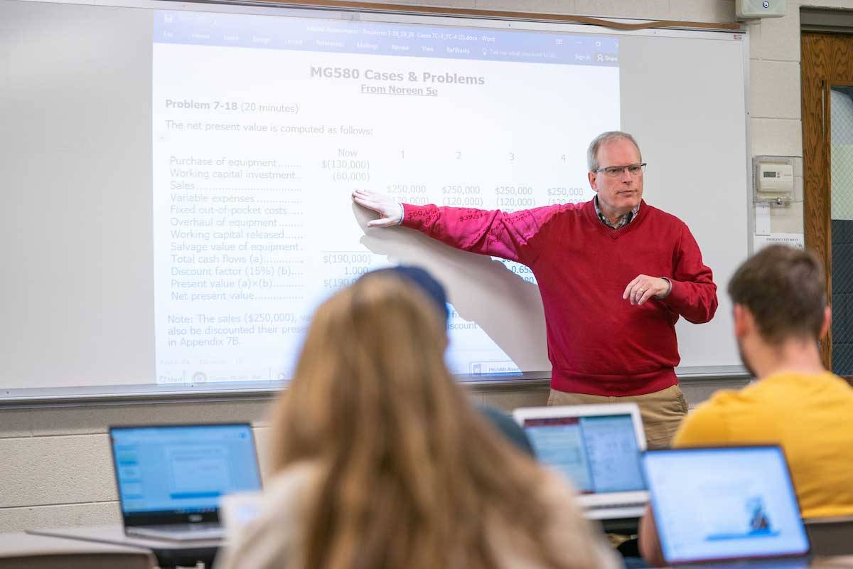 Professor lecturing at hte board