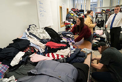 Students packing donated goods into boxes