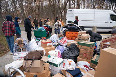 Students loading boxes onto trucks