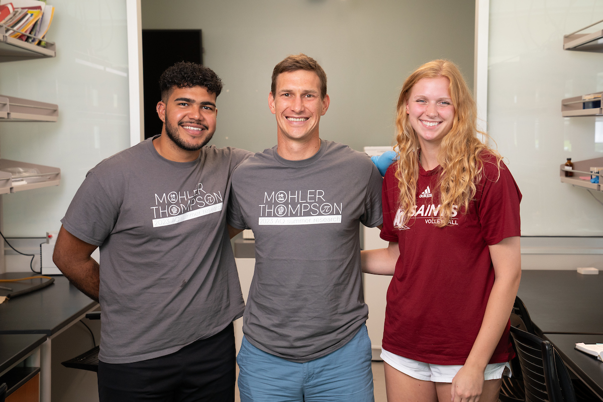 Dr. Peters, Ernesto Lopez, and Alyssa Detweiler pose for a photo in the lab