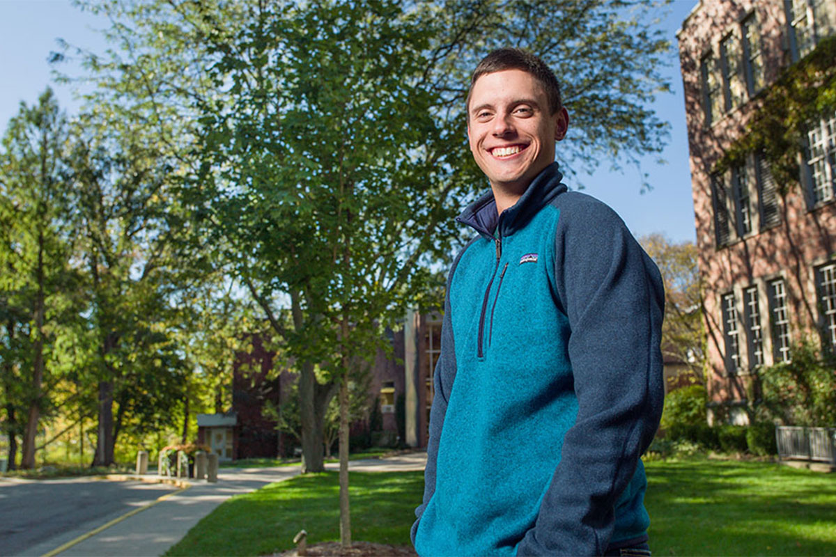 Student standing in front of AB