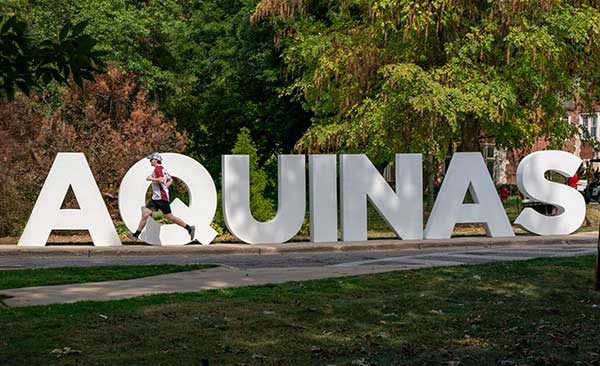 Aquinas sign with large letters