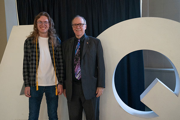 Kevin Cantley presenting Outstanding Accounting Student award to Caleb Koster