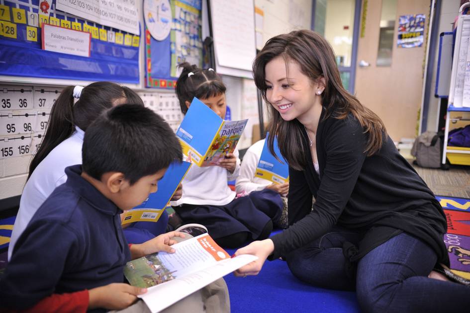 Teacher on the floor with students