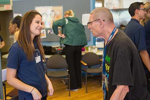 Student with community member