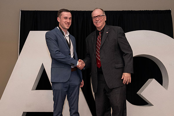 Kevin Cantley presenting Outstanding Accounting Student award to Finlay Pittock