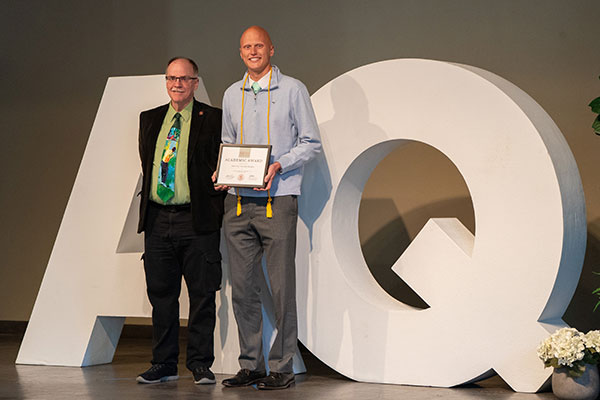 Kevin Cantley presenting Outstanding Accounting Student award to Johnny VanderBaan