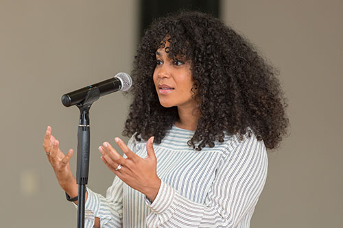 Student speaking at microphone