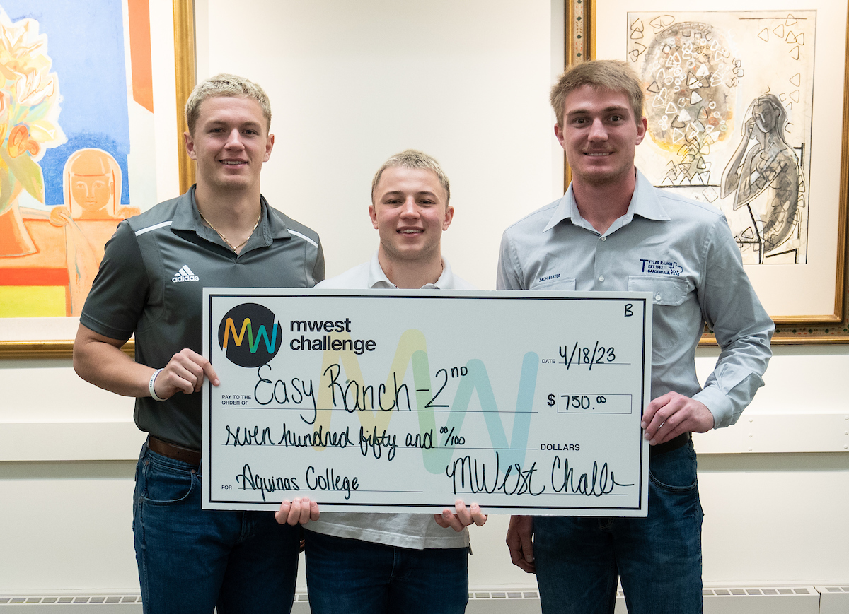 Three Students holding an oversized Check for EasyRanch