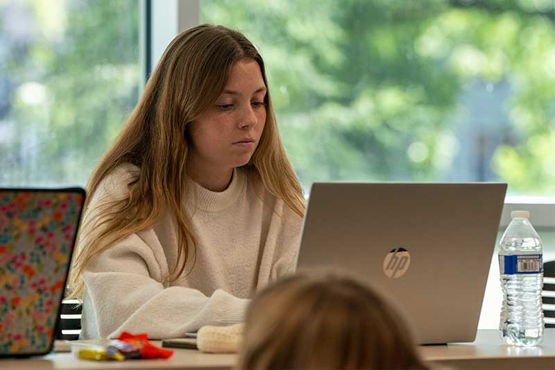 Nursing student in Albertus Hall classroom