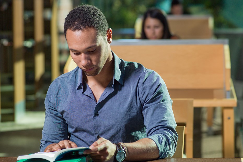 Student reading in library