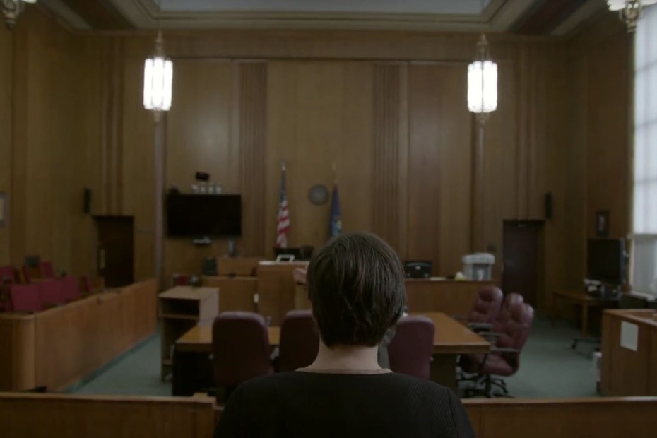 Person facing away from camera out at a courtroom