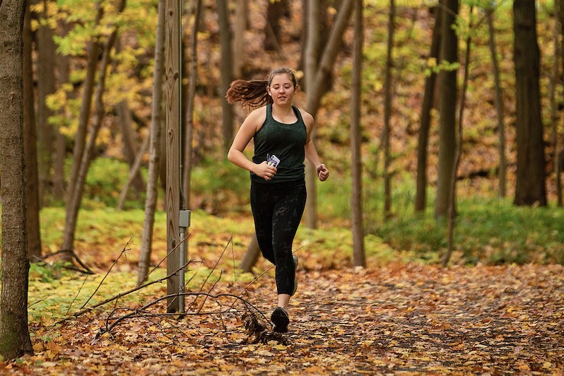 Student running on campus